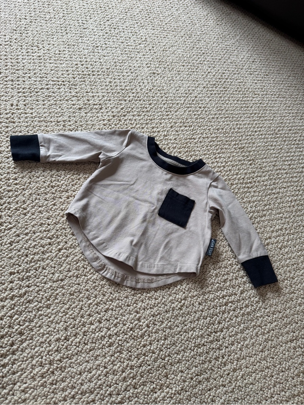 Little Bipsy Beige Long-Sleeve Top with Black Trim and Pocket